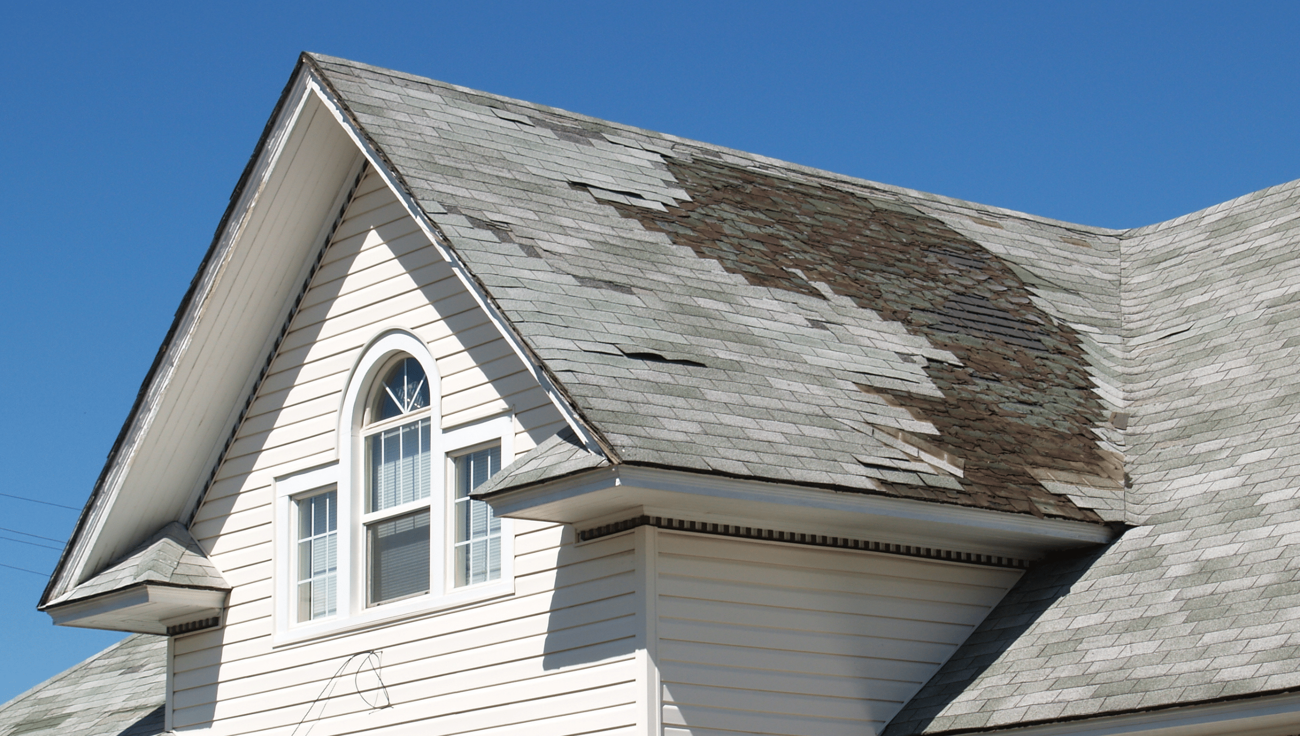 A roof with damage that needed a roof insurance claim in Michigan