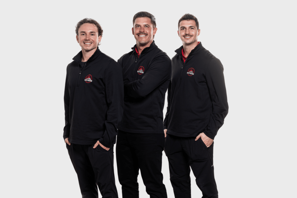 Three Pilot Roofing team members smiling